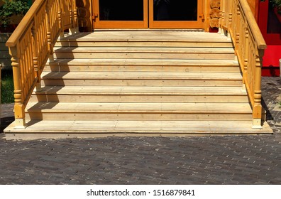 Detail Of A Wooden Porch - Steps And Rails