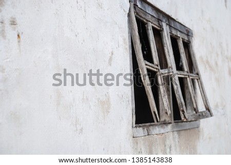 Detail of wooden windows of abandoned white house in northern Spain, Cantabria