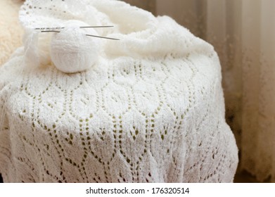 Detail of woven handicraft knit woolen design texture and clew. Fabric white background