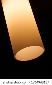 A Detail Of A Yellow Frosted Glass Lamp Shade, Black Background