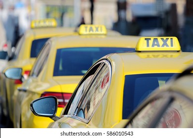 detail of yellow taxi cars on the street