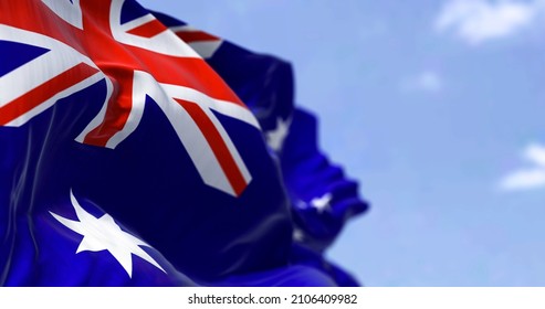 Detailed close up of the national flag of Australia waving in the wind on a clear day. Democracy and politics. Australian continent. Selective focus.