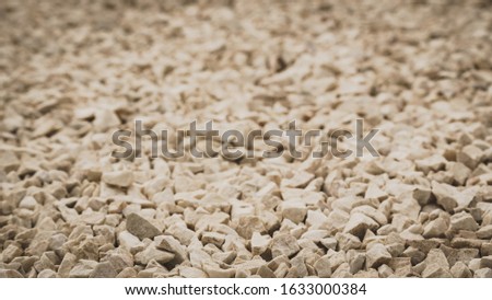Detailed close up of texture pattern with brown black little stones and rocks. Abstract background concept.