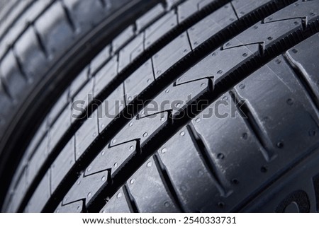 Detailed close up of tread pattern on new summer car tire