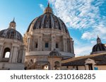 Detailed close up view on Michelangelos Dome of St Peter Basilica in Vatican City, Rome, Lazio, Europe, EU. Architectural masterpiece of Papal Basilica of Saint Peter. Church sightseeing on sunny day