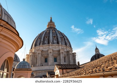 Detailed close up view on Michelangelos Dome of St Peter Basilica in Vatican City, Rome, Lazio, Europe, EU. Architectural masterpiece of Papal Basilica of Saint Peter. Church sightseeing on sunny day