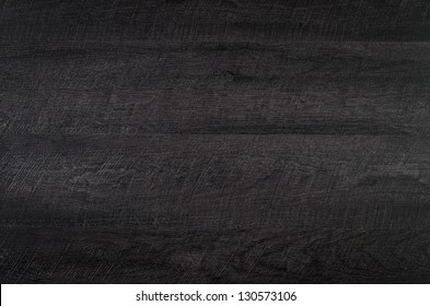 Detailed closeup of black wood texture background.