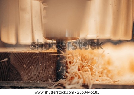 Detailed close-up of a CNC machine precisely milling a wooden plank, creating fine shavings and showcasing automated woodworking in a modern industrial workshop