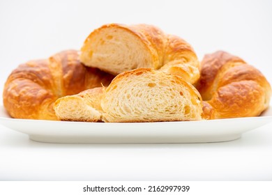 Detailed And Closeup Photo Of A Fresh Baked Plain Buttery And Flaky Croissant.