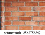 Detailed close-up of a red brick wall showing the texture of bricks and mortar