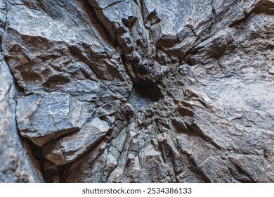 a detailed close-up of a rock wall, seemingly marked by an explosion or some form of significant impact - Powered by Shutterstock