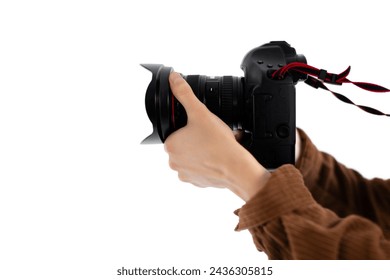Detailed close-up shot focuses on hands of male photographer holding professional camera with red strap, capturing the essence of photography - Powered by Shutterstock - Get 15% off with code: PIKWIZARD15