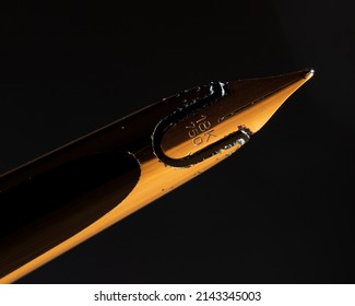 Detailed closeup of worn corroded fountain pen with 18 karat gold nib.