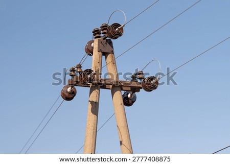 Detailed electrical equipment. Sophisticated array of electrical insulators composed of ceramics and metal parts showcasing industrial craftsmanship and technical intricacy