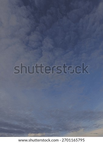 Detailed highaltitude cloud texture in a deep blue-gray sky.Perfect close-up of altocumulus and cirrus clouds. Ideal layer for sky replacement, weather apps, and digital composite, Perfect for nature.