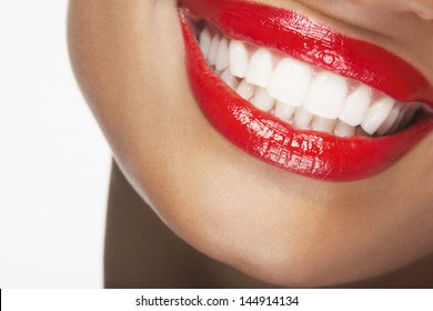 Detailed Image Of Beautiful Woman Smiling With Red Lips On White Background