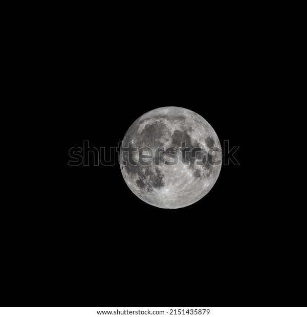 Detailed image of the\
full moon. Full moon against the black night sky. Full moon\
background isolated on\
black