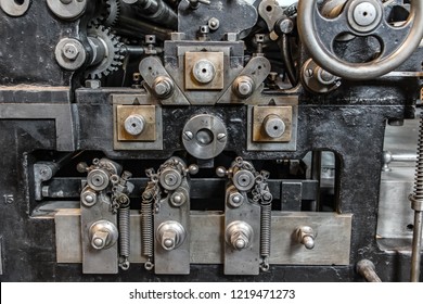 The Detailed Look At The Part Of High-speed Rocking Press, Made In Germany 1910. A Steel Machine Complicated  As Perpetuum Mobile, Close Up.