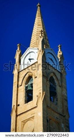 Detailed Low Angle View of Neogothic Church Spire in Gozo Malta