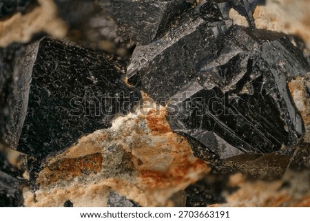 Detailed macro shot: sharp edges, metallic luster, iridescence. Illustrates magnetite structure — primary iron ore formed in magmatic and hydrothermal environments
