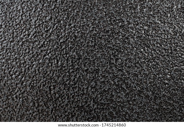 Detailed metal coating\
texture. Corrosion-resistant coating. Abstract background. A\
closeup. Dark colors. Background image. Space for text. Desktop\
wallpaper. Top view.