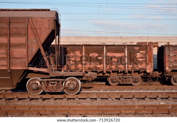 Detailed\
photo of railway freight car. A fragment of the component parts of\
the freight car on the railroad in\
daylight