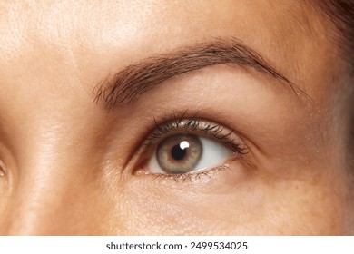 Detailed photo of woman's face, preorbital zone with well-kept, smooth and healthy skin. Anti-aging skincare cosmetic products. Concept of facial care, lifting, spa procedures, surgery. - Powered by Shutterstock