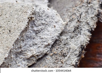 Detailed photography of roof covering material with asbestos fibres. Health harmful and hazards effects. Prolonged inhalation of microscopical fibers causes fatal illnesses including lung cancer. 