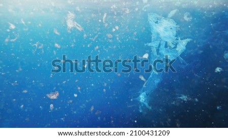 Detailed photography of sea water contaminated with micro plastic. Environment pollution concept.