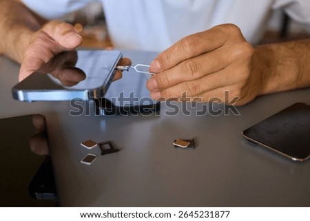 Detailed Process of Installing a SIM Card Utilizing Various Smartphone Components and Accessories