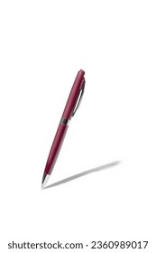 Detailed purple classic ballpoint pen writing on white surface with its shadow. Isolated on white background with clipping path