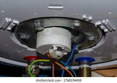 Detailed Shot Of The Bottom Of The Water Heater. Leaking Outboard Home Boiler. Repair And Maintenance Of Household Appliances. Selective Focus.