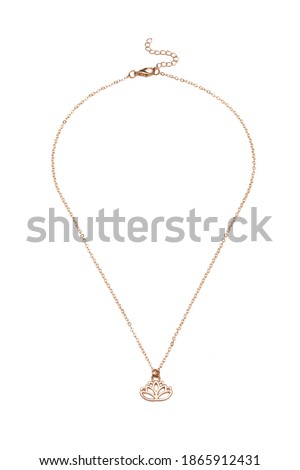Detailed shot of golden necklace made as rolo chain with lotus shaped pendant and extension chain. The elegant necklace is isolated on the white background. 