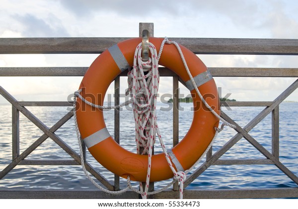 A\
detailed shot of a life buoy at the jetty in\
maldives