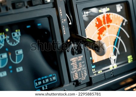 A detailed shot of the radar control and navigation panel in the cockpit of Boeing 737 Flight Simulator plane