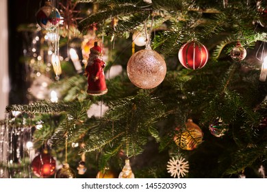 detailed shot of some christmas decoration hanging on a christmastree