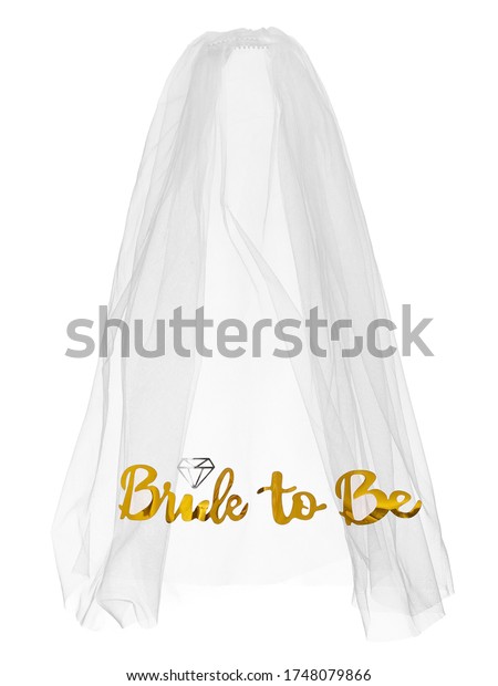 Detailed shot of a white mesh bride veil with\
golden lettering \