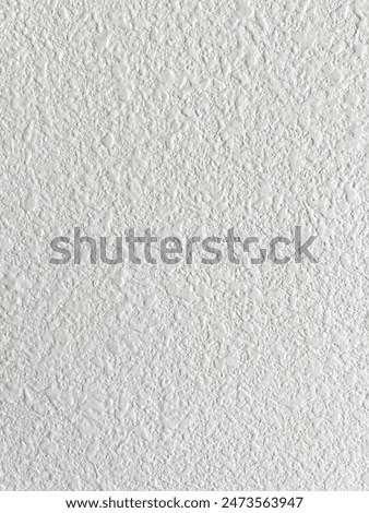 Detailed view of a ceiling texture after the removal of a popcorn ceiling. The image highlights the smooth, updated finish, showcasing the results of a common home improvement project.
