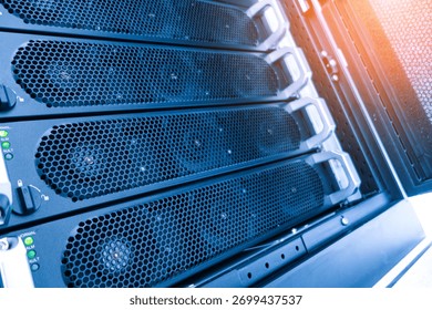 A detailed view of computer server hardware in a data center, showcasing cooling systems, network connections, and essential components for optimal performance.