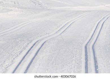 Detailed view of cross-country snow trail tracks in winter Austria.