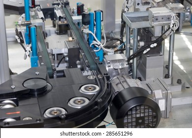 Detailed view of an empty assembly line for the production of plastic components. Horizontally. All potential trademarks are removed.