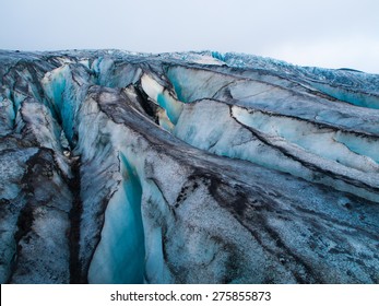Detailed view of glacier structure with blue vivid colors and dirty ice, Iceland - Powered by Shutterstock