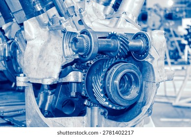 Detailed view of interlocking metal cogs and gears in a mechanical device. Industrial engineering