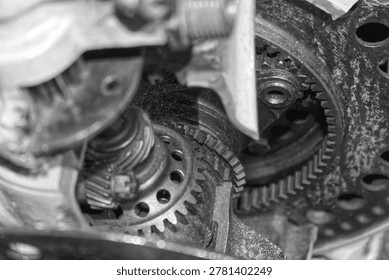 Detailed view of interlocking metal cogs and gears in a mechanical device. Industrial engineering