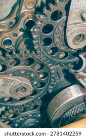 Detailed view of interlocking metal cogs and gears in a mechanical device. Industrial engineering