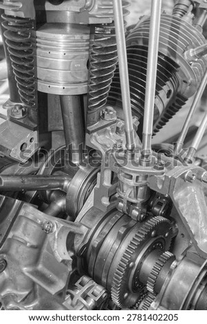 Detailed view of interlocking metal cogs and gears in a mechanical device. Industrial engineering