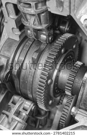 Detailed view of interlocking metal cogs and gears in a mechanical device. Industrial engineering