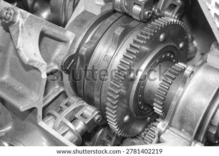 Detailed view of interlocking metal cogs and gears in a mechanical device. Industrial engineering