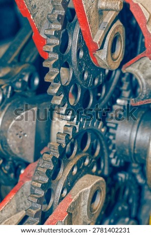 Detailed view of interlocking metal cogs and gears in a mechanical device. Industrial engineering