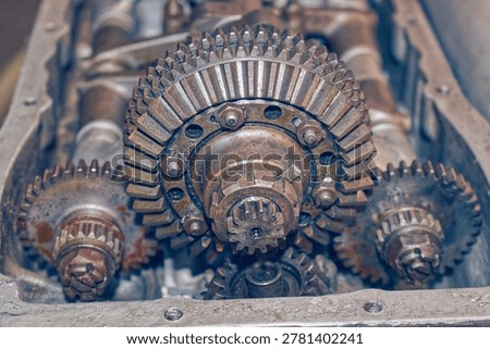 Detailed view of interlocking metal cogs and gears in a mechanical device. Industrial engineering